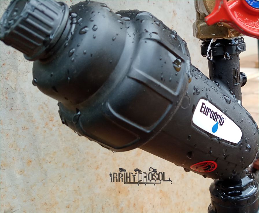 Image showing a water filtration unit connected to a drip irrigation system, designed to capture sediments and protect emitters from blockage