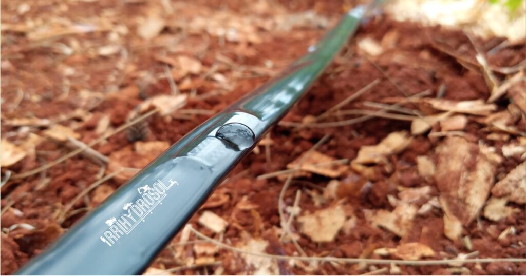 A detailed view of a drip tape emitter precisely releasing water—highlighting the efficiency and water-saving capability of our drip irrigation systems